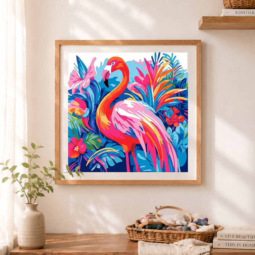 Finished floral flamingo cross stitch artwork displayed as home decor