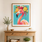 Finished floral flamingo portrait cross stitch artwork displayed as home decor