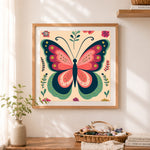 Finished floral folk‑style butterfly cross stitch artwork displayed as home decor