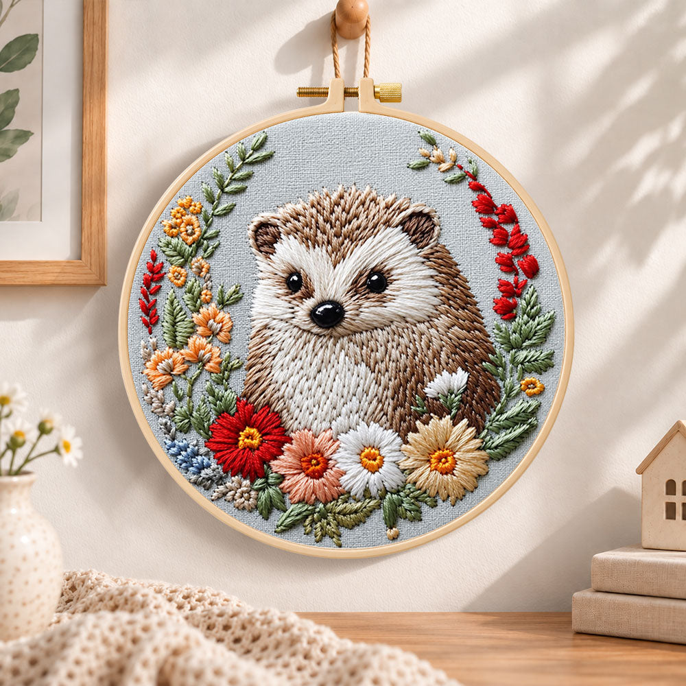 Floral framed hedgehog embroidery hoop wall art displayed as warm and cozy handmade home decor