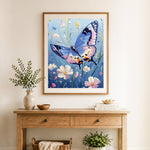 Finished floral garden blue butterfly cross stitch artwork displayed as home decor
