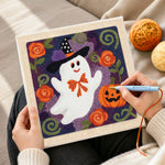 Creating handmade floral ghost with witch hat punch needle artwork