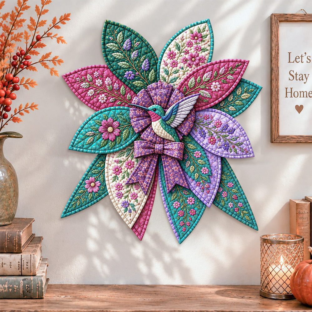 Floral hummingbird quilted bow displayed as handmade wall decor in a cozy home