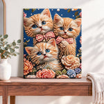 Finished floral kitten trio pearl diamond painting artwork displayed as home decor