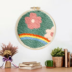 Finished floral meadow with rainbow artwork displayed on a wall