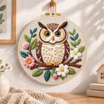 Floral owl on branch embroidery hoop wall art displayed as warm and cozy handmade home decor