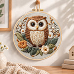Floral owl portrait embroidery hoop wall art displayed as warm and cozy handmade home decor