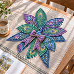 Floral peacock handmade quilted bow displayed on a table as seasonal home decor