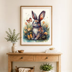 Finished floral rabbit with butterflies cross stitch artwork displayed as home decor