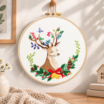 Floral reindeer art embroidery hoop wall art displayed as warm and cozy handmade home decor