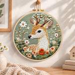 Floral sika deer embroidery hoop wall art displayed as warm and cozy handmade home decor