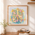 Finished floral skeleton art cross stitch artwork displayed as home decor