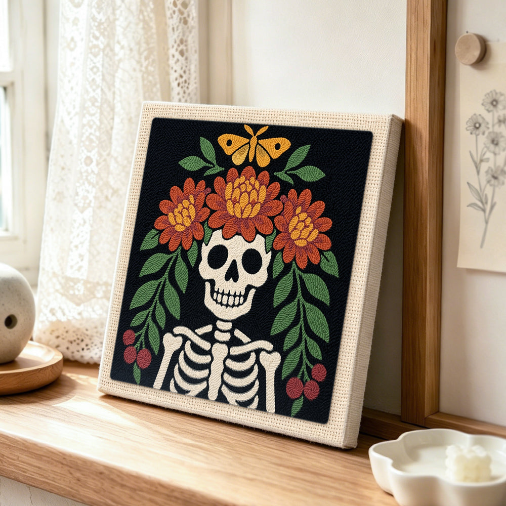 Floral skeleton punch needle artwork displayed on a table