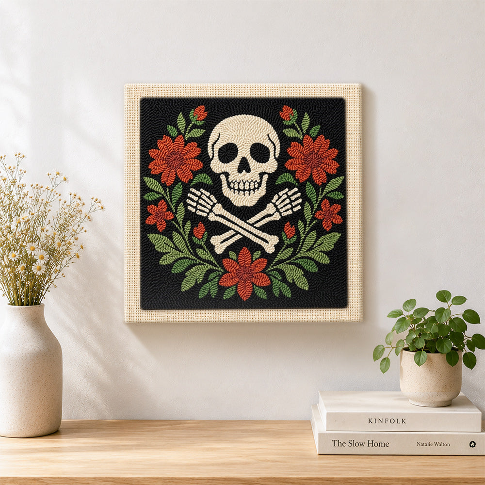Finished floral skull and crossbones artwork displayed on a wall