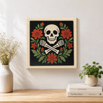 Finished floral skull and crossbones artwork displayed on a wall