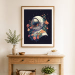 Finished floral space explorer cross stitch artwork displayed as home decor