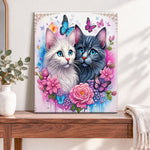 Finished floral twin cats pearl diamond painting artwork displayed as home decor