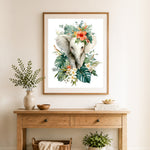 Finished floral white baby elephant cross stitch artwork displayed as home decor