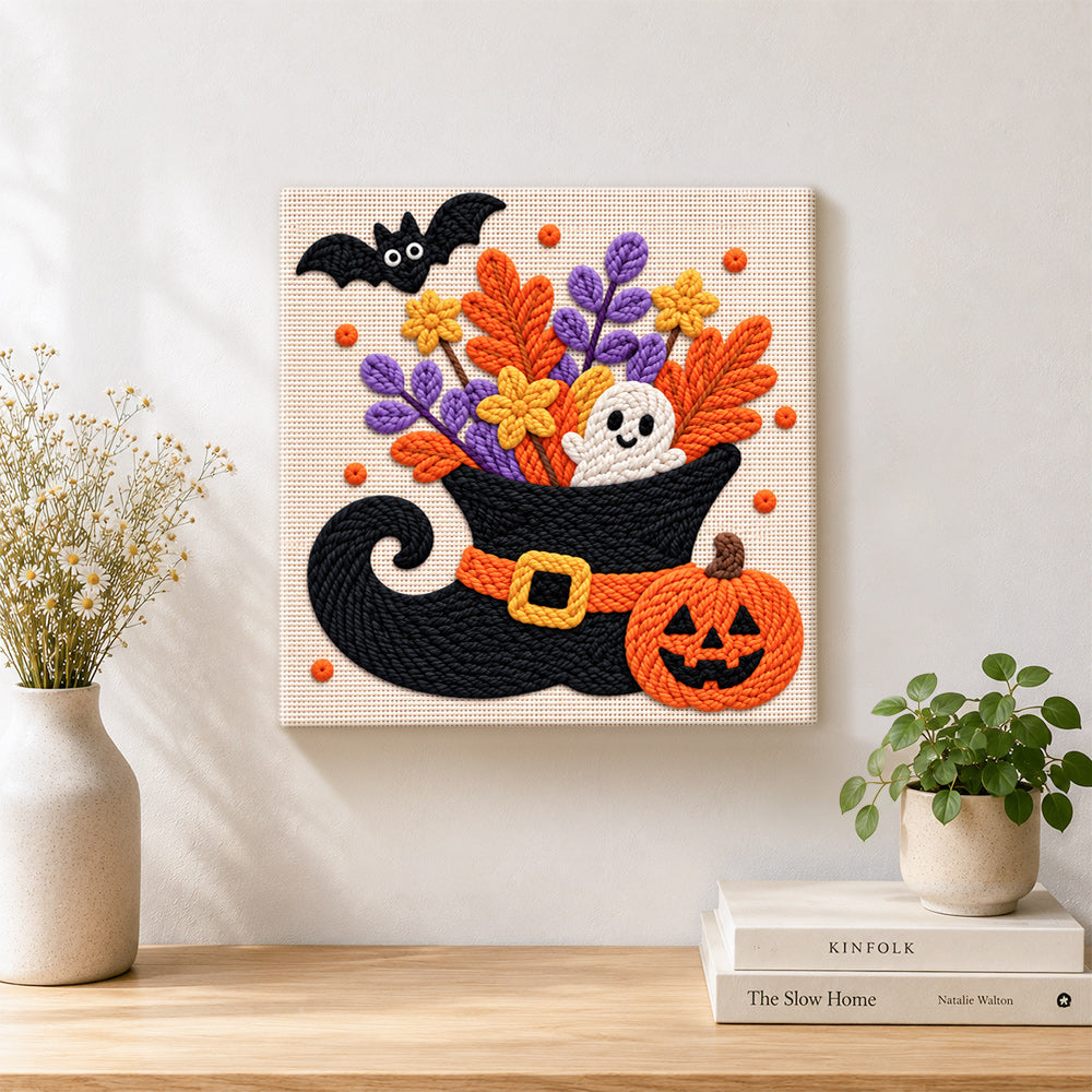 Finished floral witch hat ghost artwork displayed on a wall