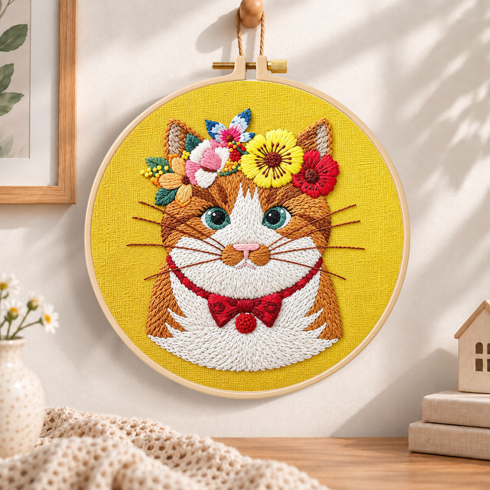 Flower crown cat embroidery hoop wall art displayed as warm and cozy handmade home decor