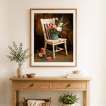 Finished flowers on rustic chair cross stitch artwork displayed as home decor