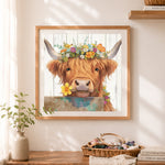 Finished fluffy highland cow with colorful florals cross stitch artwork displayed as home decor