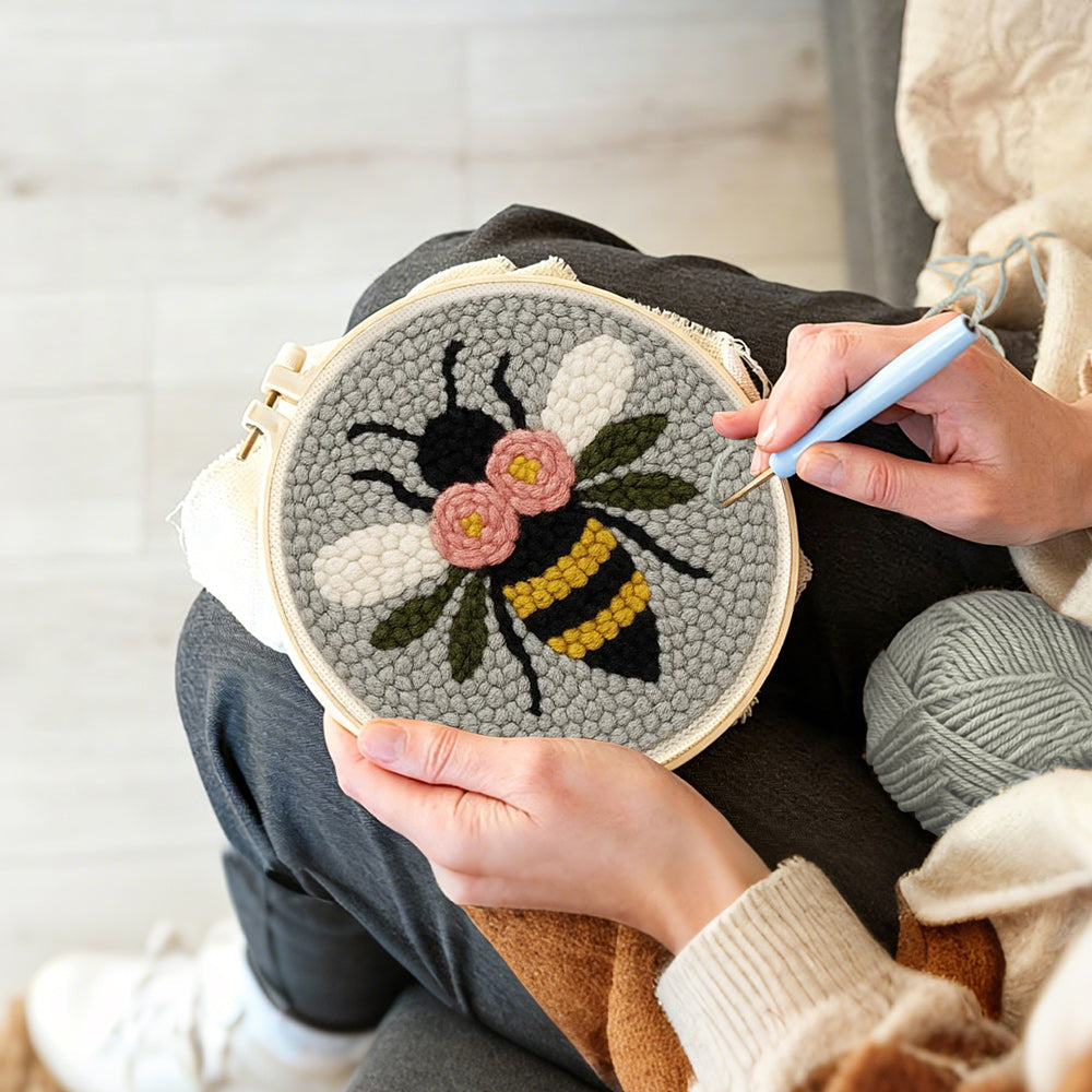 Creating handmade flying bee punch needle artwork