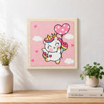 Finished flying unicorn with heart balloon artwork displayed on a wall