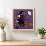 Finished flying witch on broom artwork displayed on a wall