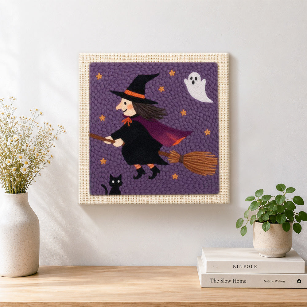 Finished flying witch on broom artwork displayed on a wall