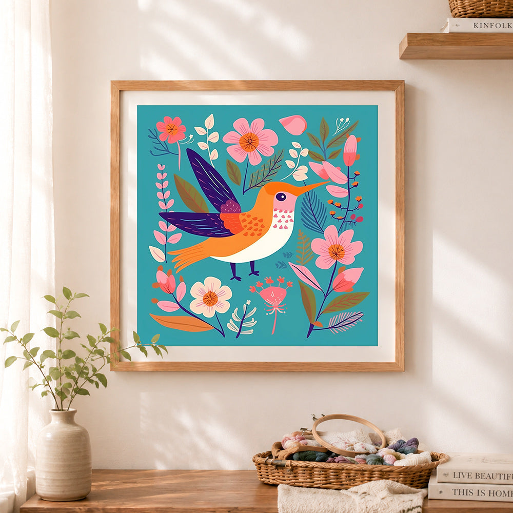 Finished folk art hummingbird and blooms cross stitch artwork displayed as home decor