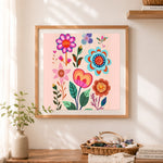 Finished folk style floral collage cross stitch artwork displayed as home decor