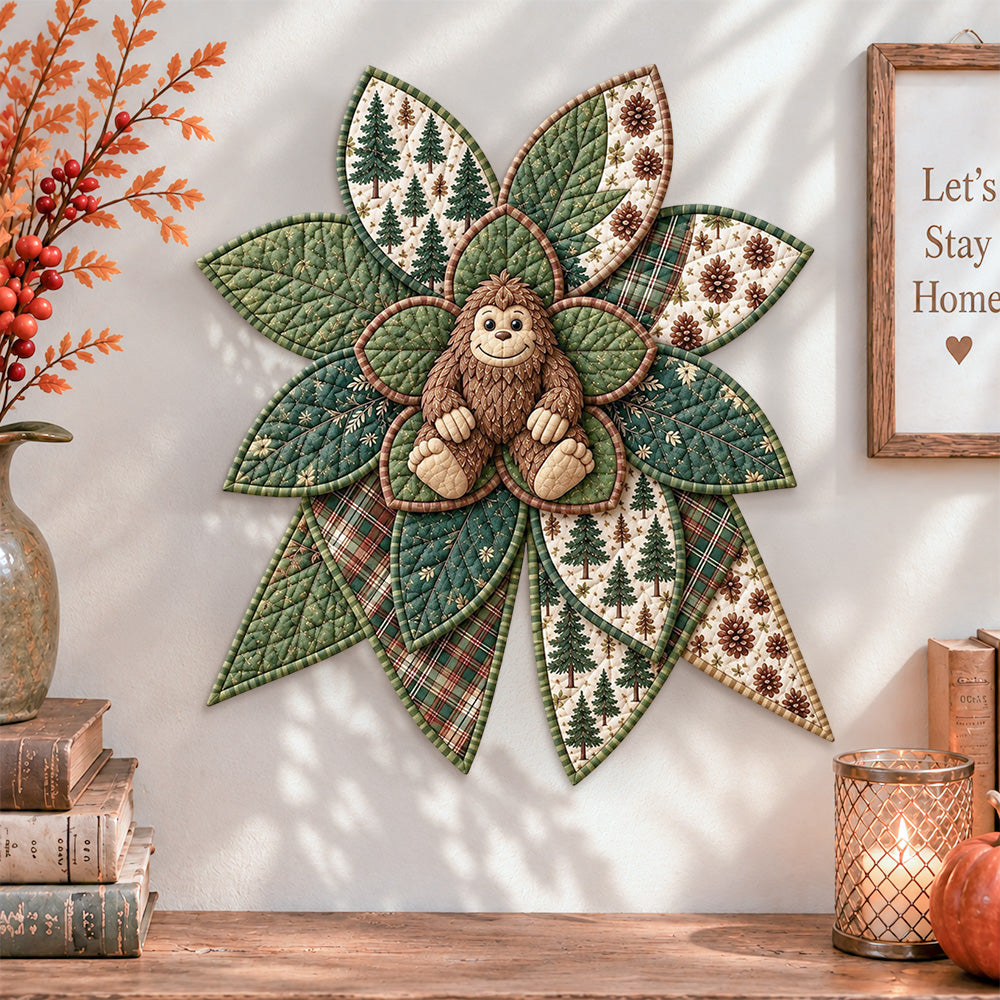 Forest bigfoot quilted bow displayed as handmade wall decor in a cozy home