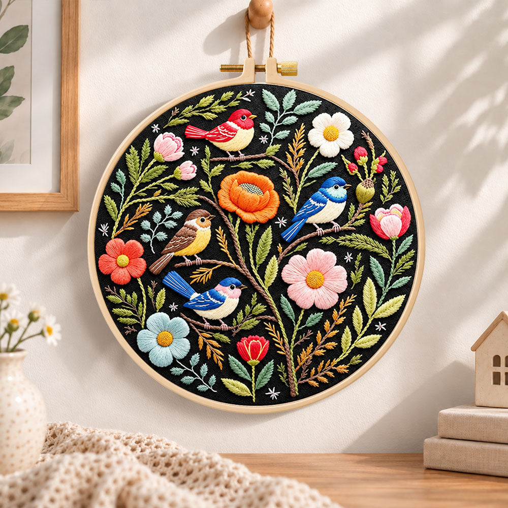 Forest birds and spring blooms embroidery hoop wall art displayed as warm and cozy handmade home decor