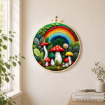 Forest rainbow and red mushrooms needle felt wall art displayed in a bright home interior