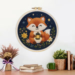 Finished fox at night leaves artwork displayed on a wall
