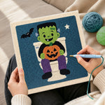 Creating handmade frankenstein on toilet punch needle artwork