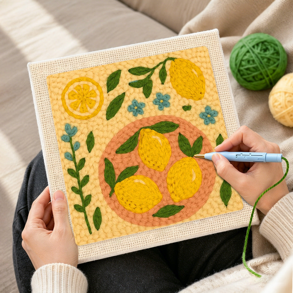 Creating handmade fresh lemons and little blue flowers punch needle artwork