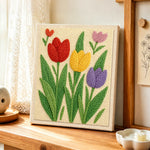 Fresh spring tulips punch needle artwork displayed on a table