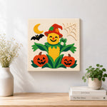 Finished friendly corn scarecrow artwork displayed on a wall