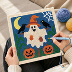 Creating handmade friendly ghost with witch hat punch needle artwork