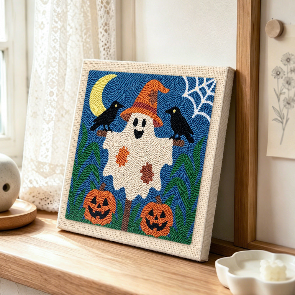 Friendly ghost with witch hat punch needle artwork displayed on a table