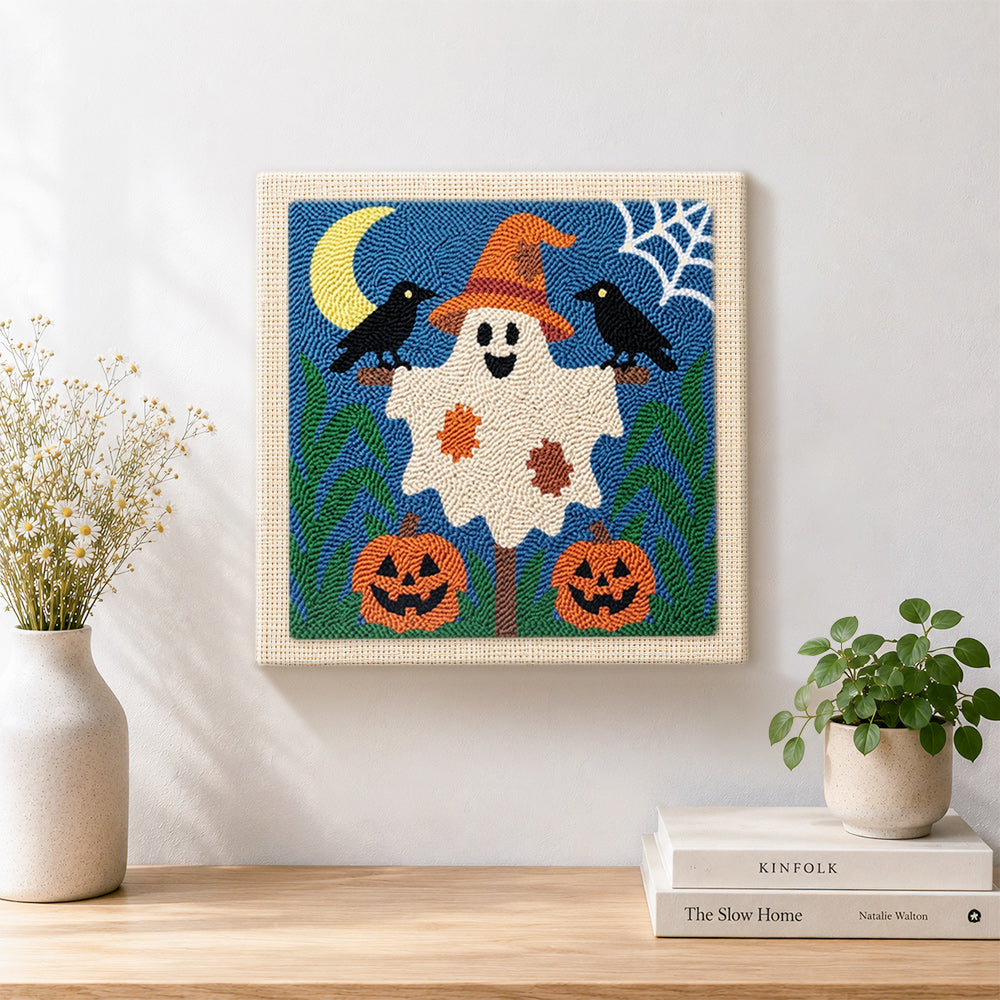 Finished friendly ghost with witch hat artwork displayed on a wall
