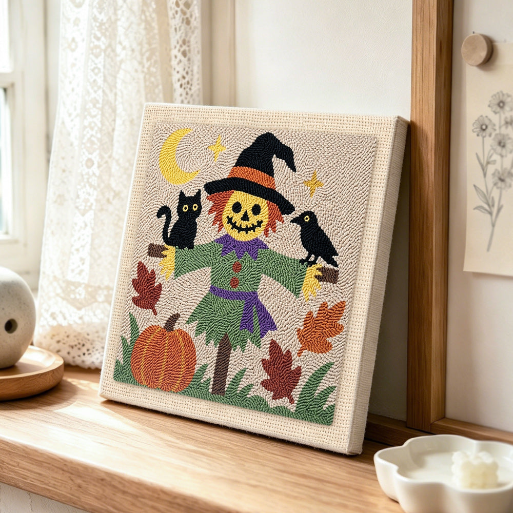 Friendly scarecrow punch needle artwork displayed on a table