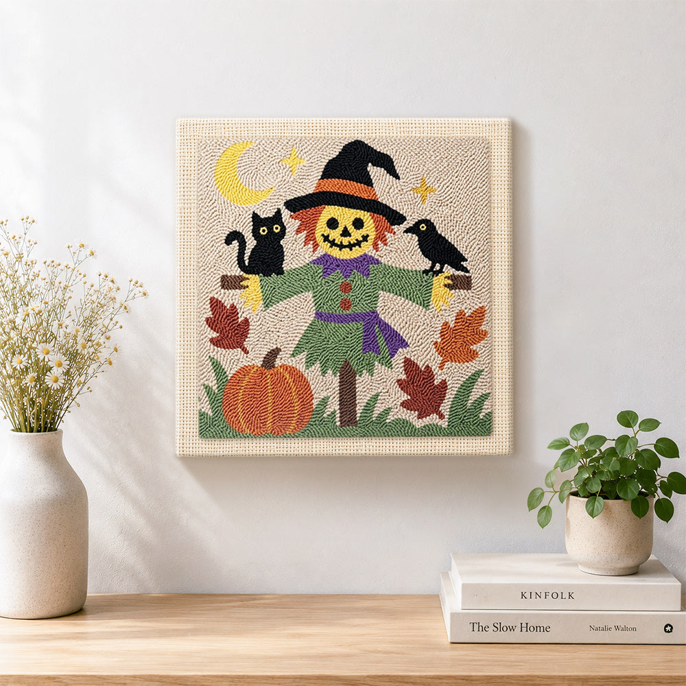 Finished friendly scarecrow artwork displayed on a wall