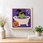 Finished frog bath time artwork displayed on a wall
