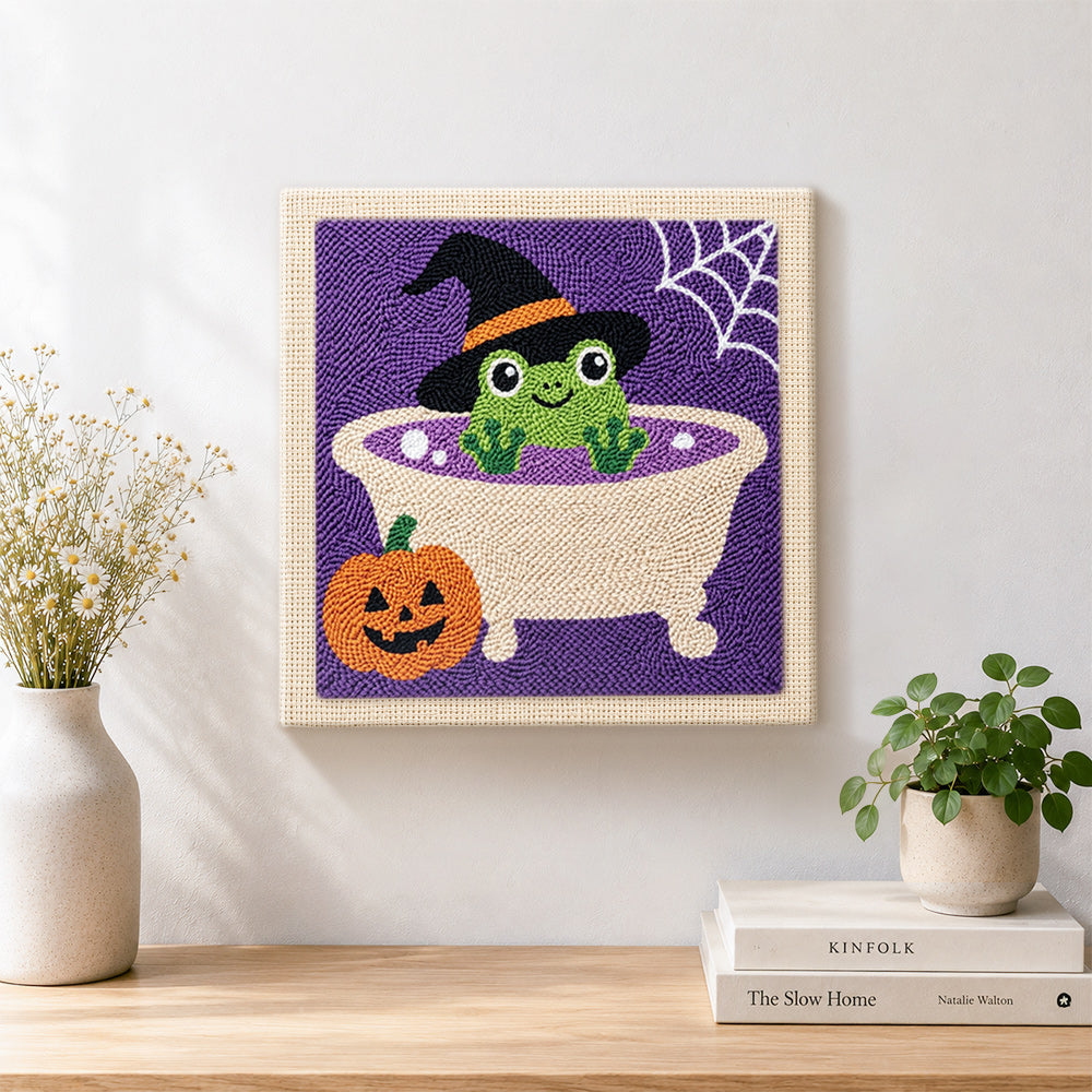 Finished frog bath time artwork displayed on a wall