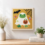 Finished frog ghost in disguise artwork displayed on a wall