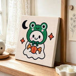 Frog ghost with candy punch needle artwork displayed on a table