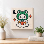 Finished frog ghost with candy artwork displayed on a wall